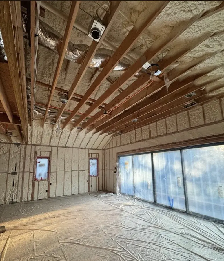 Interior walls and ceiling insulated with spray foam during new construction in Robbinsdale